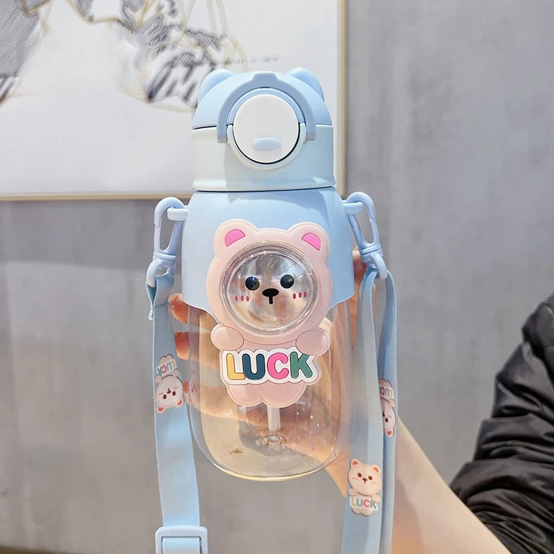 Cute kawaii water bottle with bear design and 'LUCK' text on a neutral background