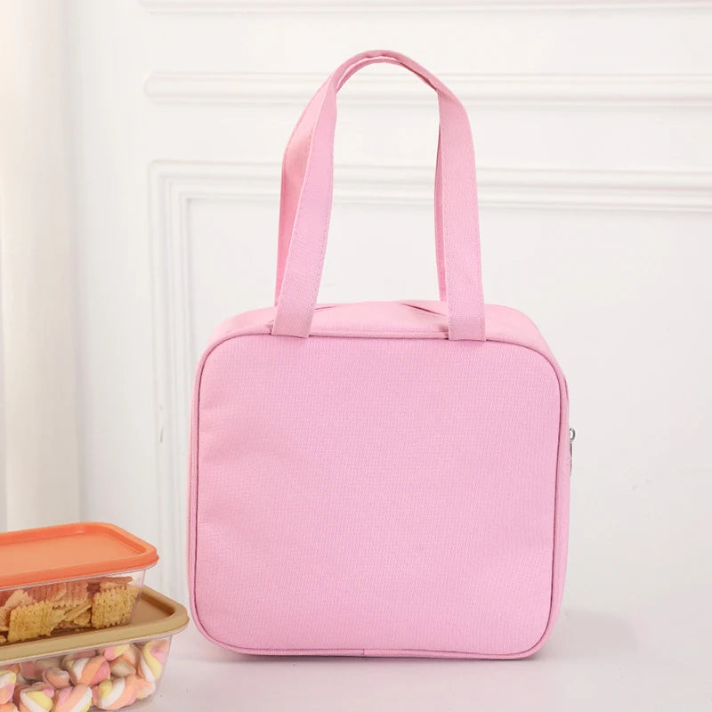 Pink insulated kawaii lunch bag on a light pink background