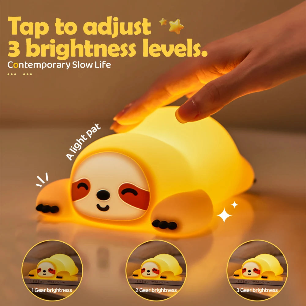 Sloth-shaped kawaii night light with a hand adjusting brightness levels on a warm background.