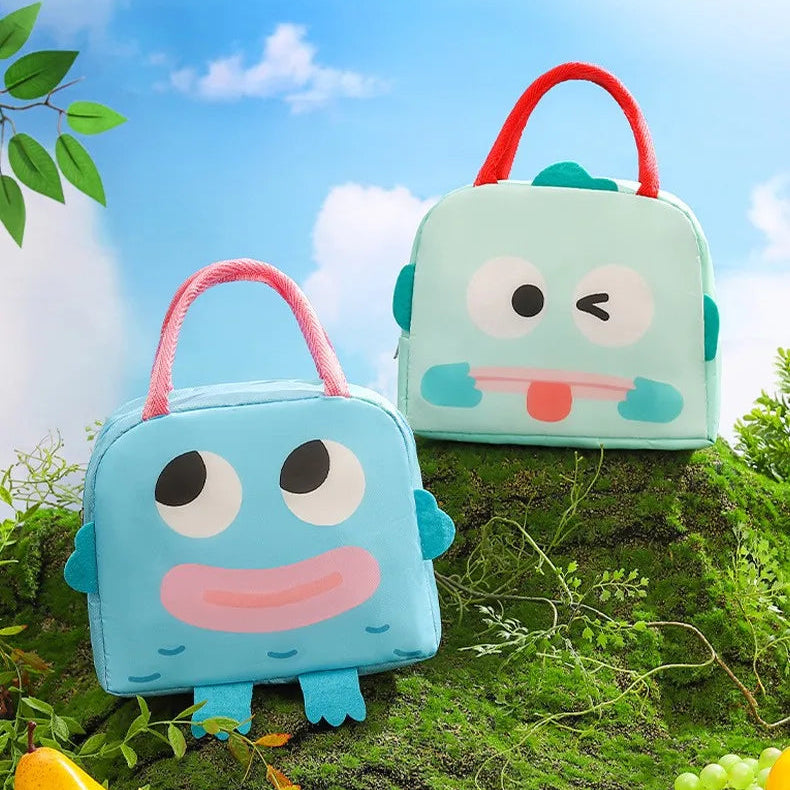 Two cartoon-style kawaii lunch bags with a blue sky and greenery background, featuring the brand 'Bento Bag'.