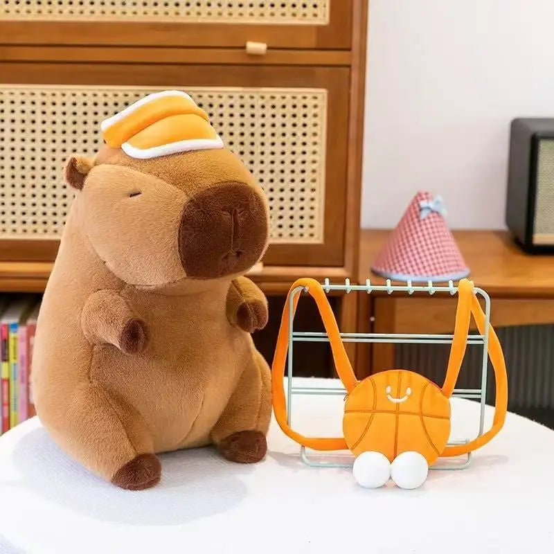 Kawaii plush toy bear with a small orange toy on a white surface with a wooden cabinet in the background.