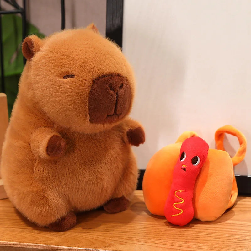 Kawaii plush toy bear and pumpkin with worm on a wooden surface