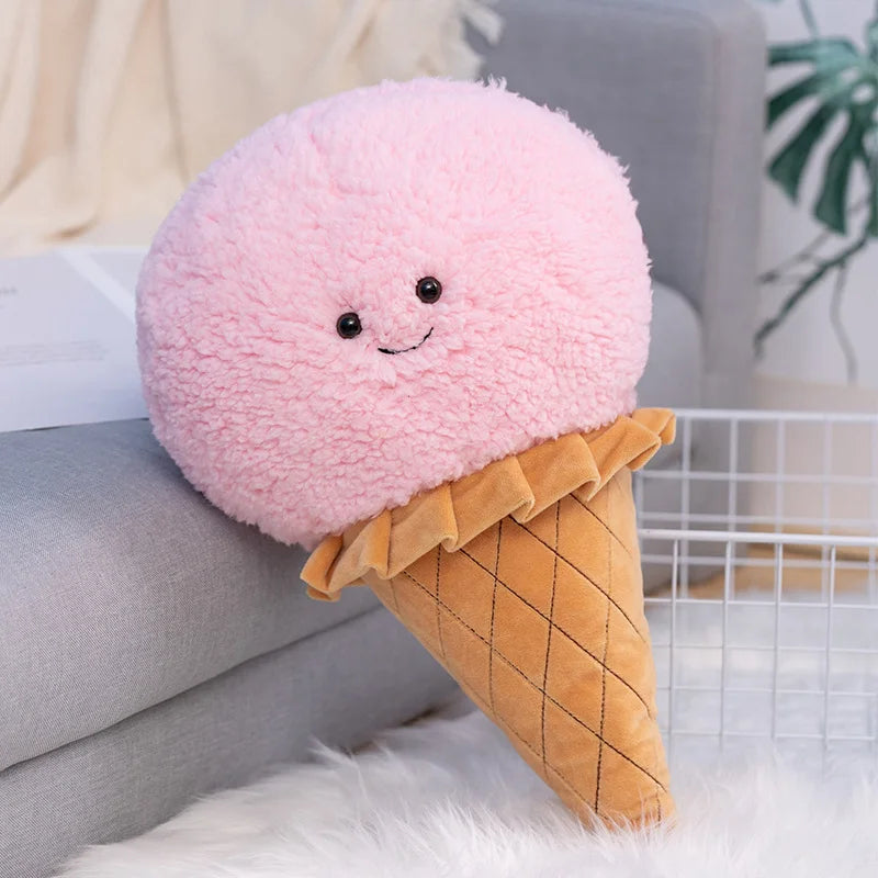 Kawaii plush toy shaped like a pink ice cream cone with a smiling face on a couch.