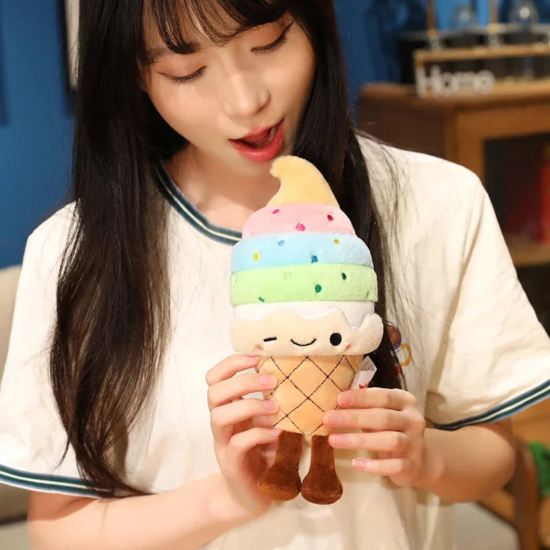 Person holding a kawaii plush ice cream toy with a colorful design