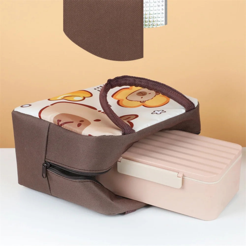 Brown kawaii lunch box with cartoon design on a white surface