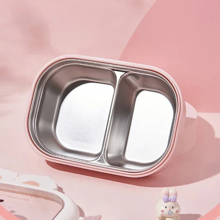 Stainless steel divided kawaii plate with pink rim on a soft pink background