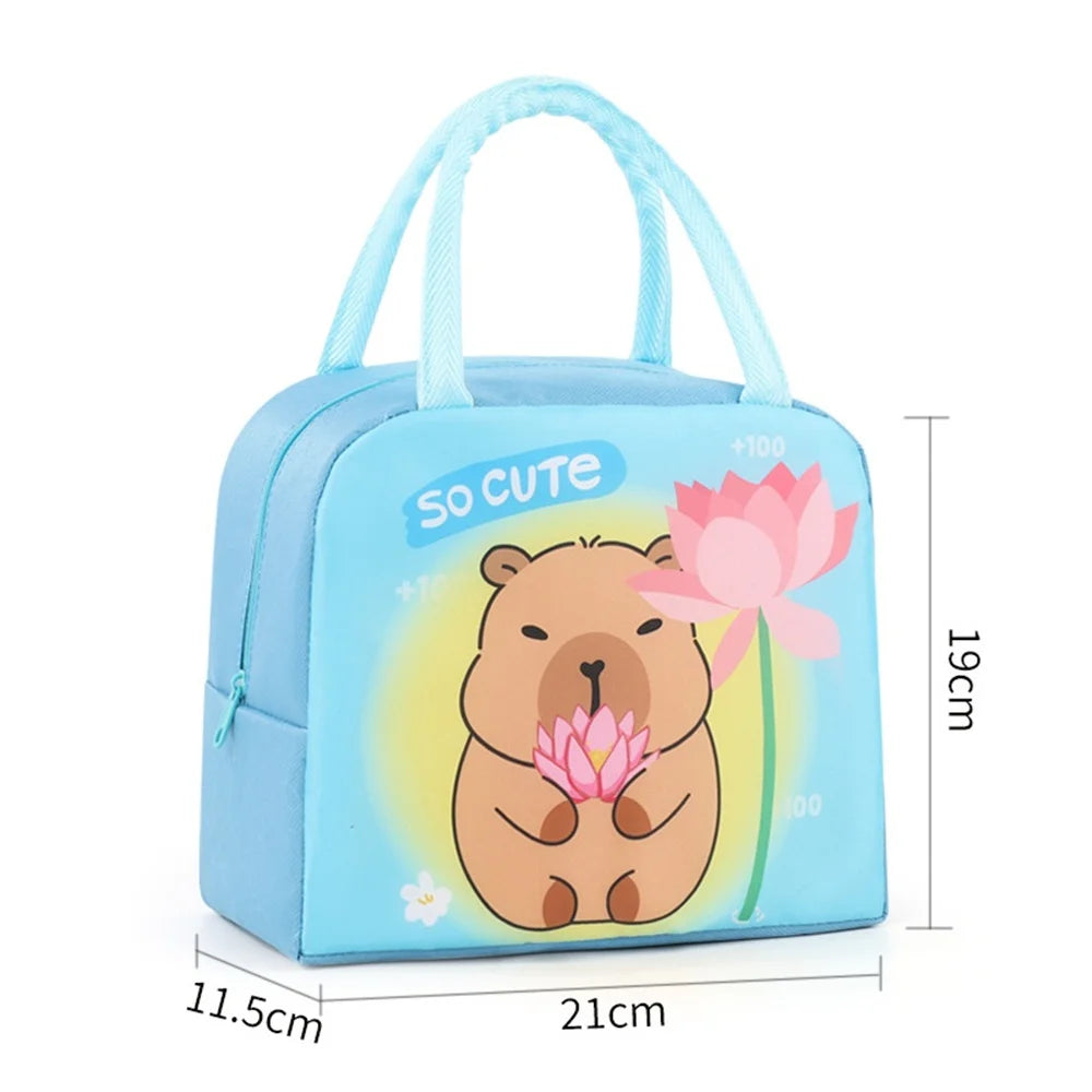 Blue children's kawaii lunch bag with a bear and flower design, labeled 'So Cute', on a white background.