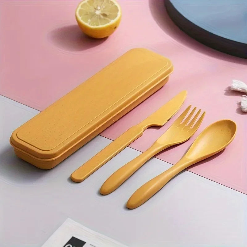 Yellow kawaii utensils set with case on a pink and gray background