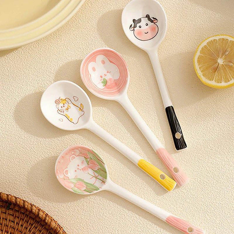 A group of four kawaii spoons on a table