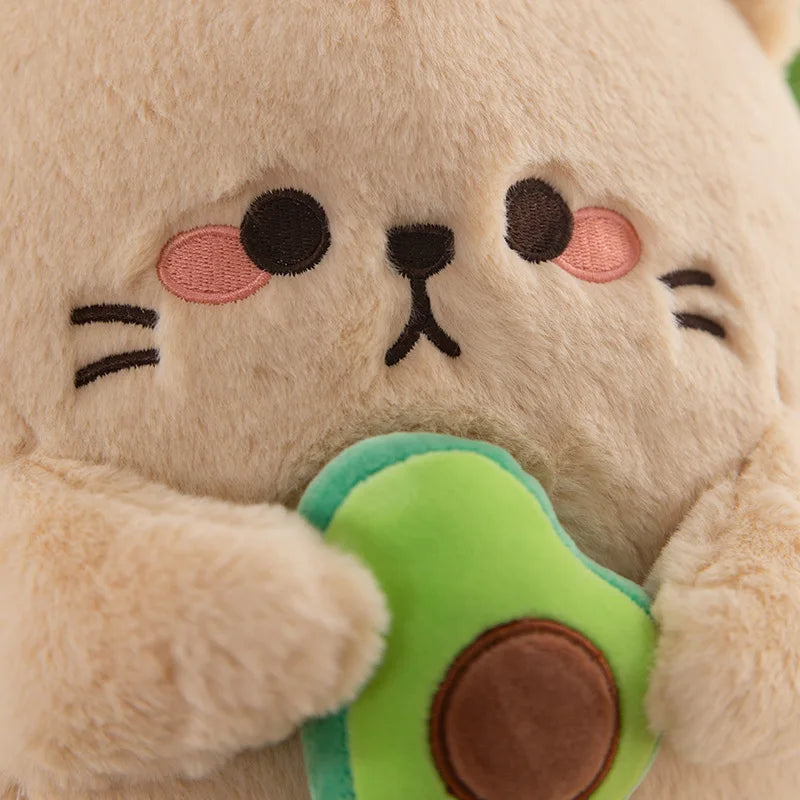 Close-up of a kawaii plush toy resembling a cat holding an avocado