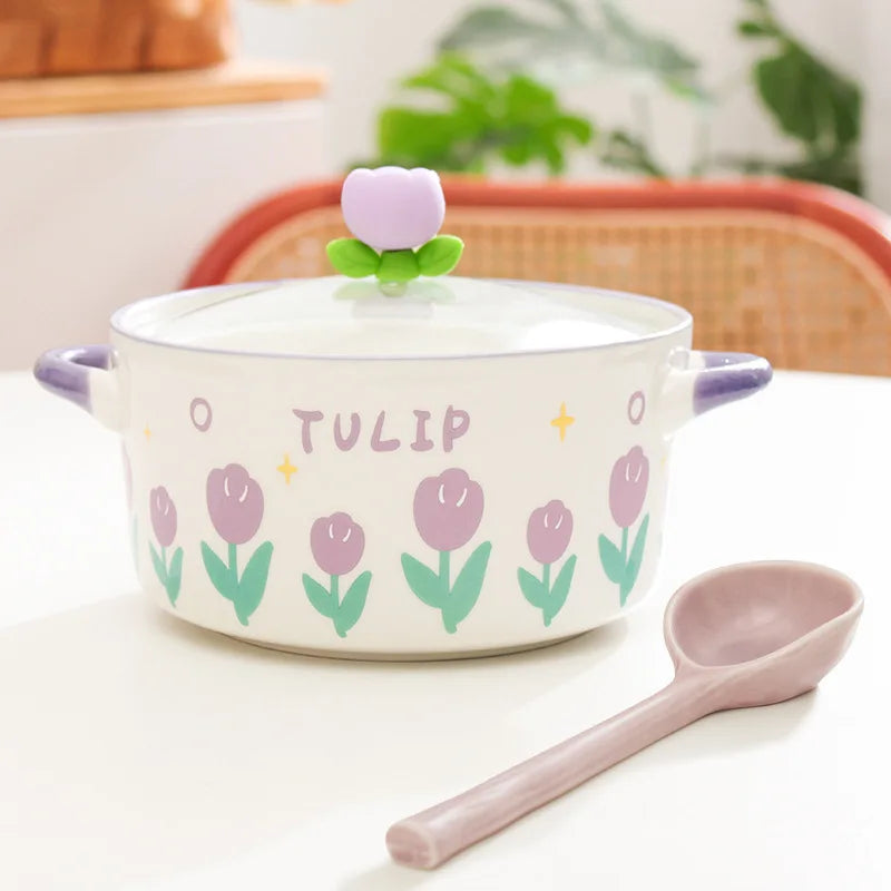 Ceramic kawaii ramen bowl with tulip design and matching spoon on a light surface