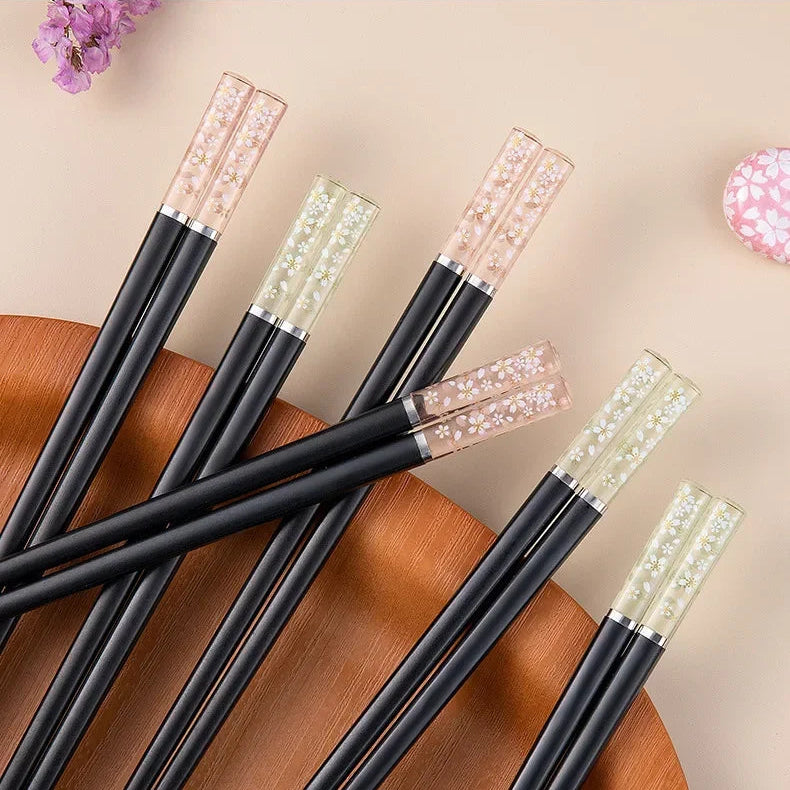 Set of kawaii chopsticks on a wooden surface