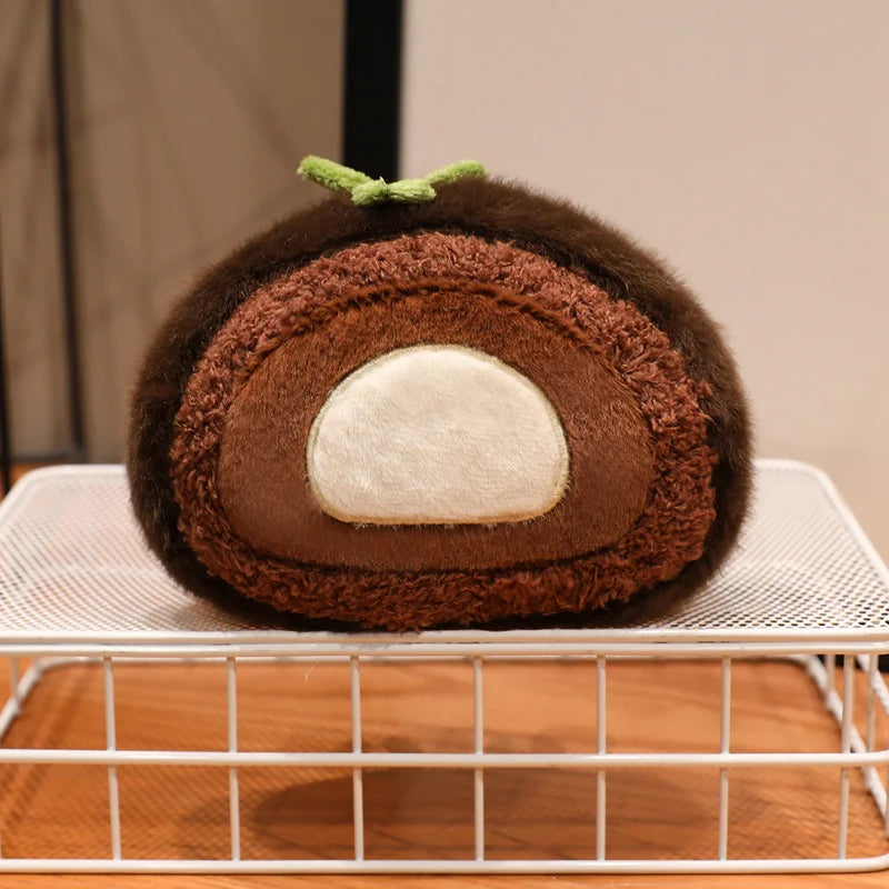 Kawaii plush toy shaped like a chocolate roll cake on a cooling rack.
