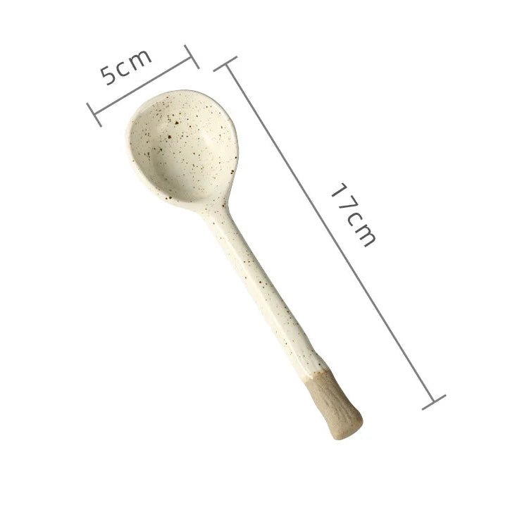 A white ceramic kawaii spoon with measurements