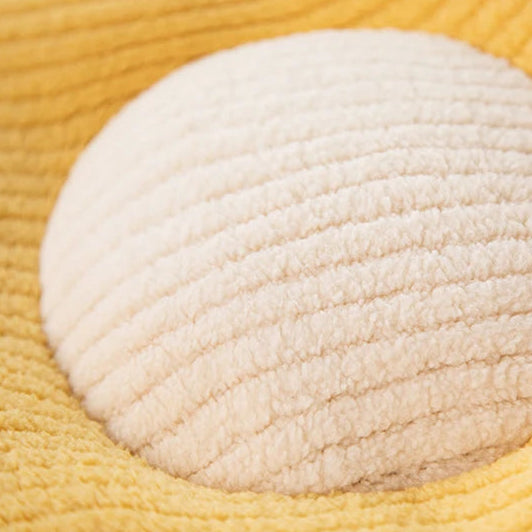 Close-up of a textured white kawaii pillow