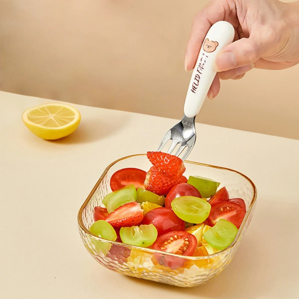 Someone eating fruit with a kawaii utensil