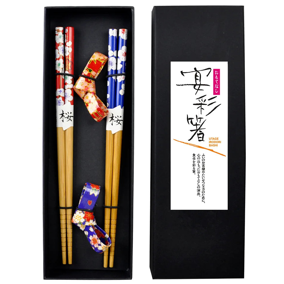 Chopsticks with decorative kawaii ends and holder in a black box with brand label.