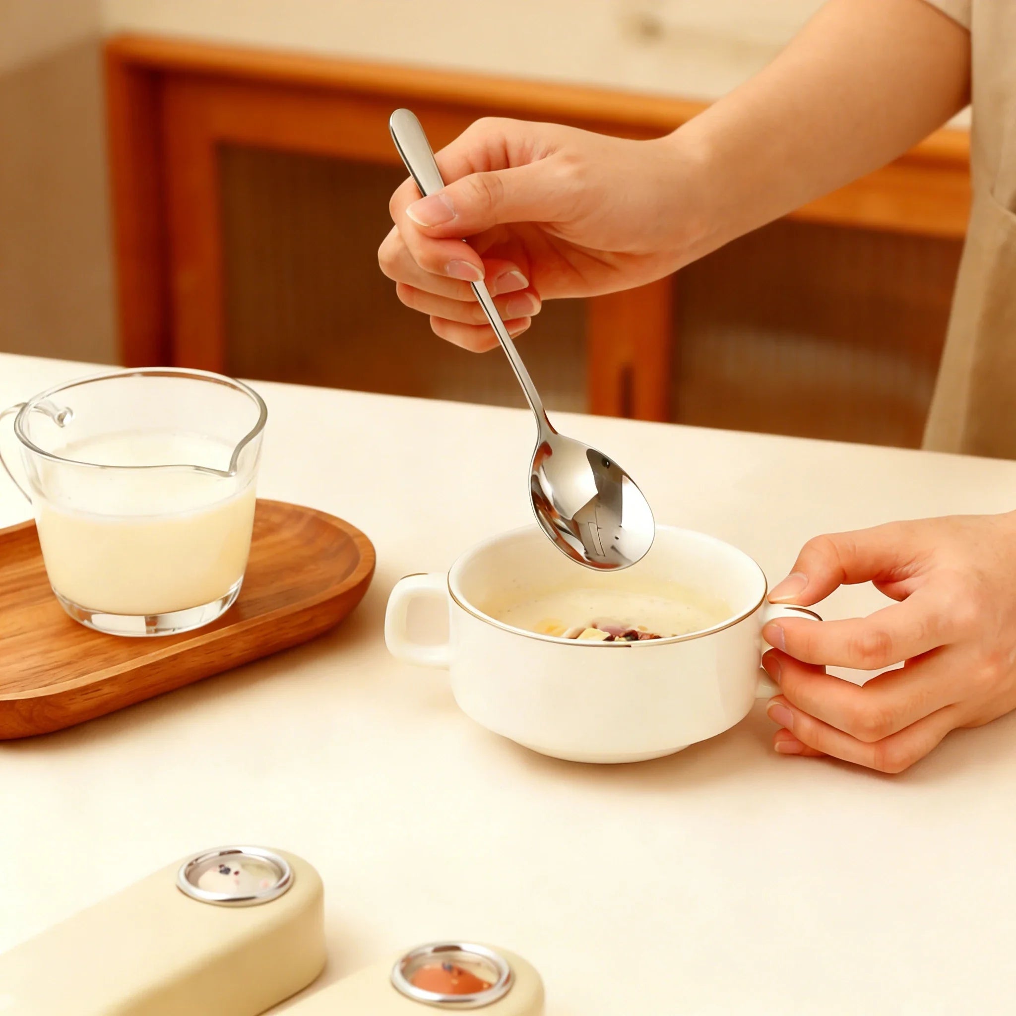 Someone eating with a steel kawaii utensils