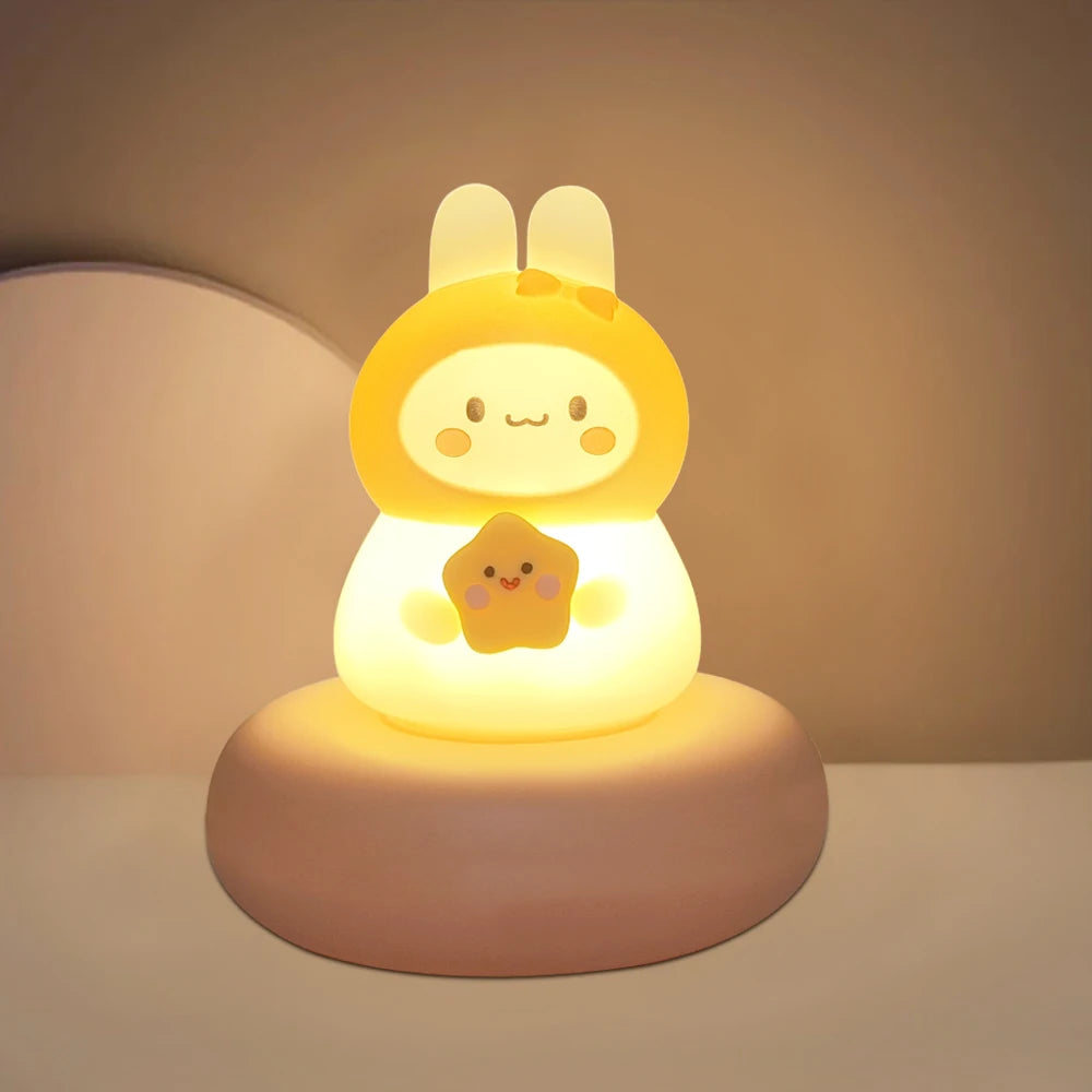Cute kawaii rabbit-shaped night light with a yellow face on a beige background