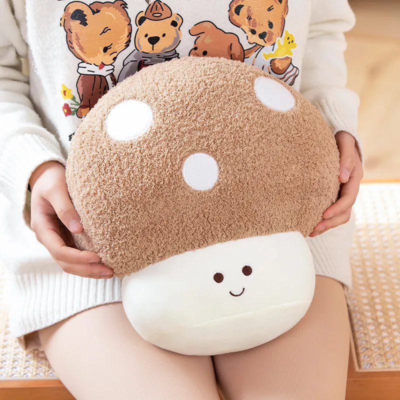 Person holding a kawaii plush mushroom pillow with cartoon bear design in the background