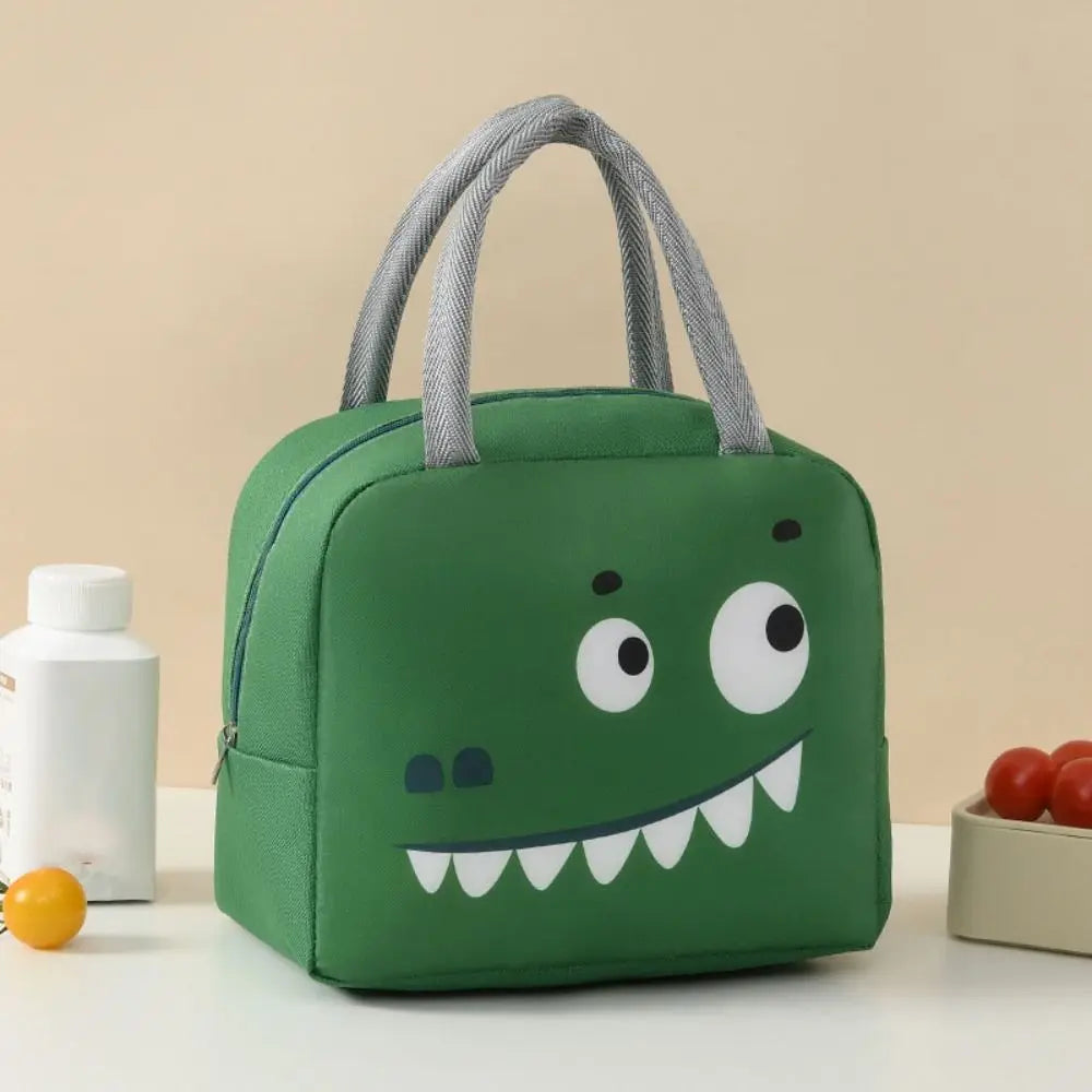Green dinosaur-shaped kawaii lunch bag on a beige background