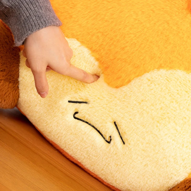 Close up of a fire-shaped kawaii cushion with a face on a wooden chair