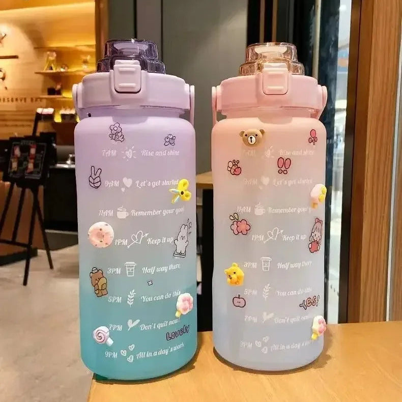 Two colorful kawaii water bottles with cartoon designs on a wooden surface.