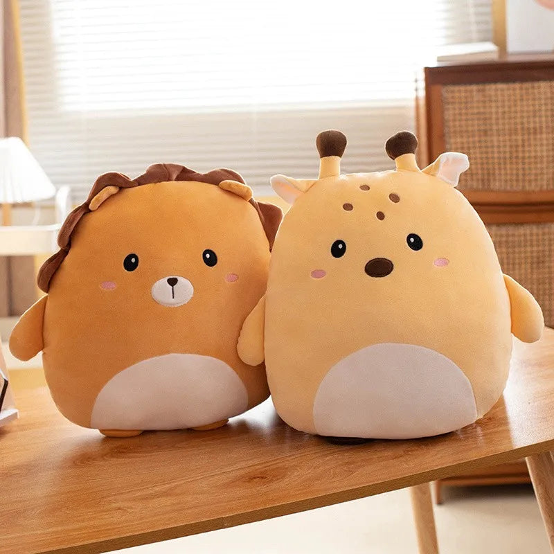 Two cute animal-shaped kawaii cushions on a wooden table with a blurred indoor background.