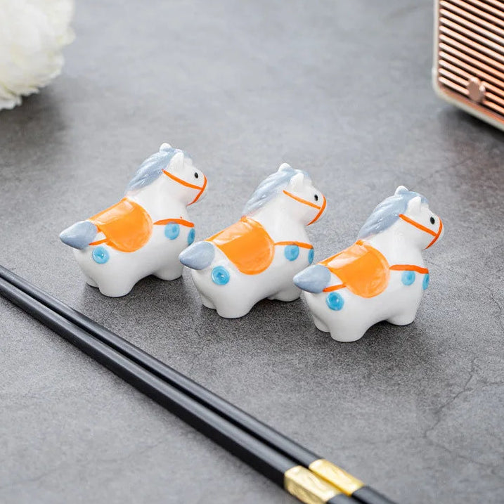 A set of three horse kawaii chopstick holders
