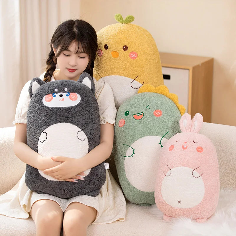 Woman holding a gray kawaii plush toy with four other colorful plush toys on a couch.
