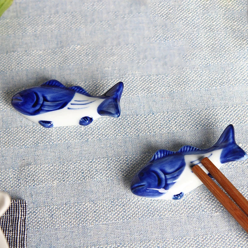 Two blue and white ceramic fish kawaii chopstick holders