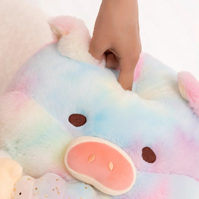 A close up of a kawaii plush toy of a pig and a person pressing their finger into it