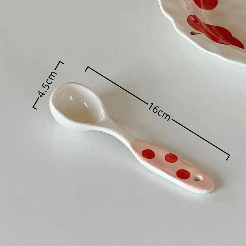 A white ceramic kawaii spoon on a table