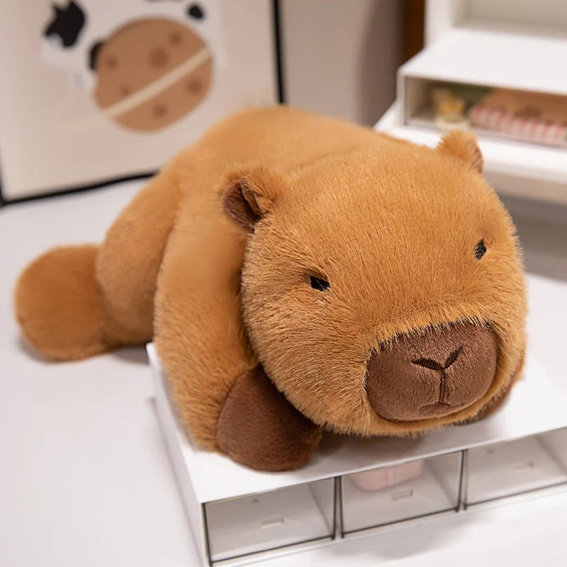 Brown kawaii teddy bear plush toy on a white surface with a blurred background