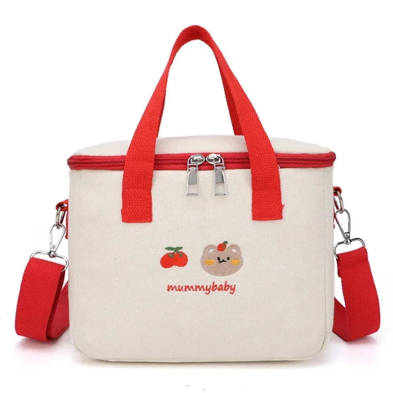White kawaii lunch bag with red handles and strap, featuring 'mummy baby' design on a white background.