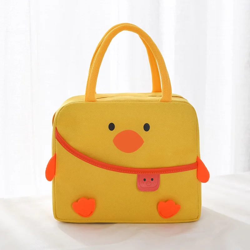 Yellow duck-shaped kawaii lunch bag with orange accents on a white background