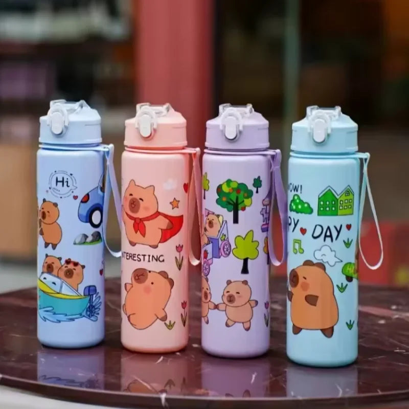 Four colorful kawaii water bottles with cartoon designs on a reflective surface.