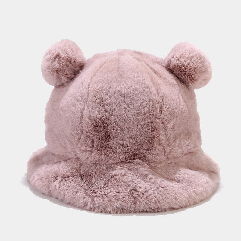 Pink fluffy Kawaii hat with bear ears on a light gray background