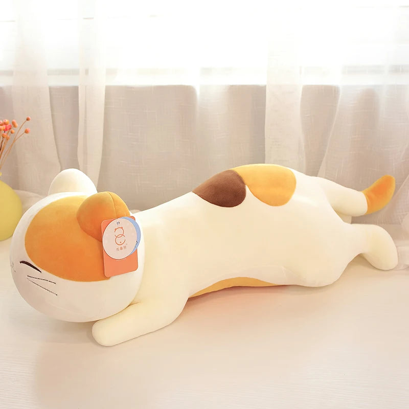 Plush kawaii toy resembling a cartoon character with a tag on a light background