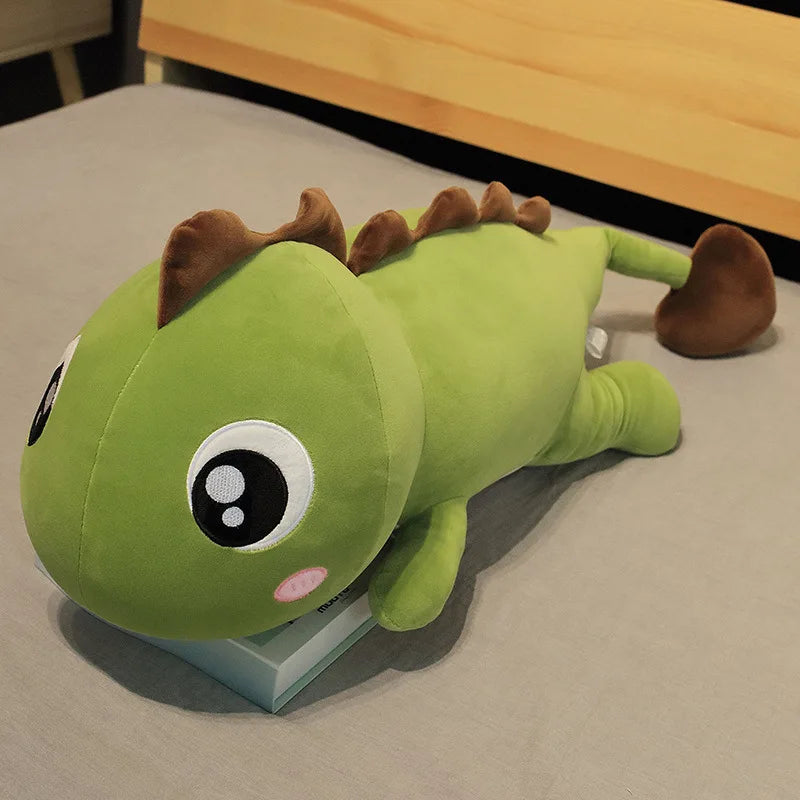 Green kawaii plush toy lizard on a table