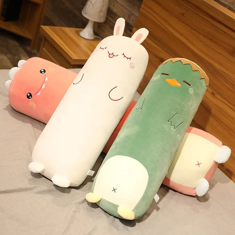 Set of cartoon-shaped kawaii cushions on a bed with wooden flooring in the background