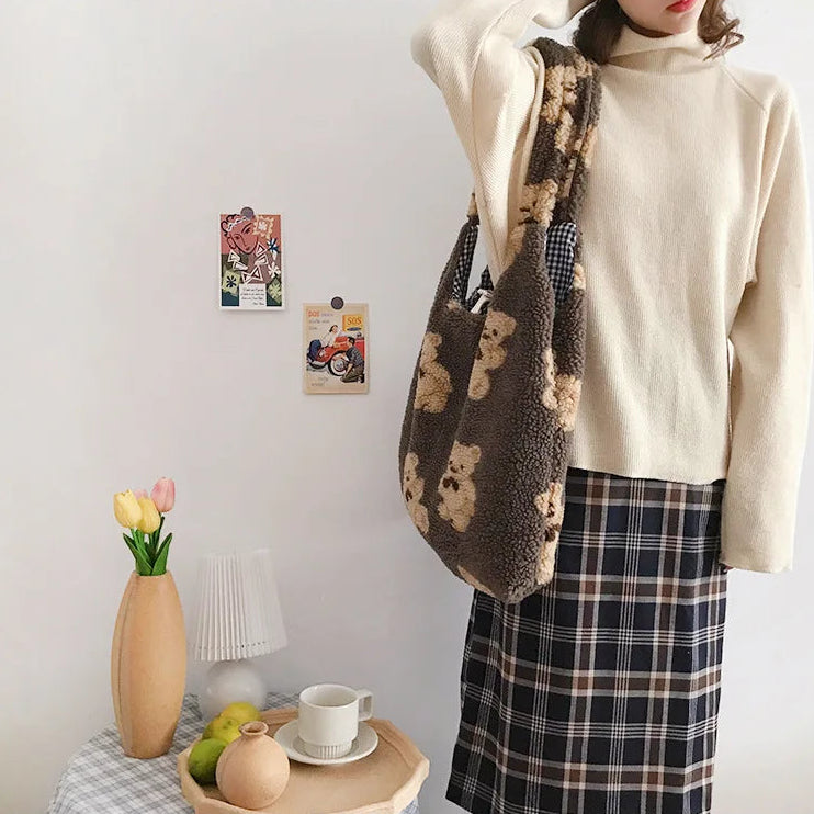Person wearing a patterned kawaii bag with a minimalistic room setting featuring a lamp, vase, and fruit.