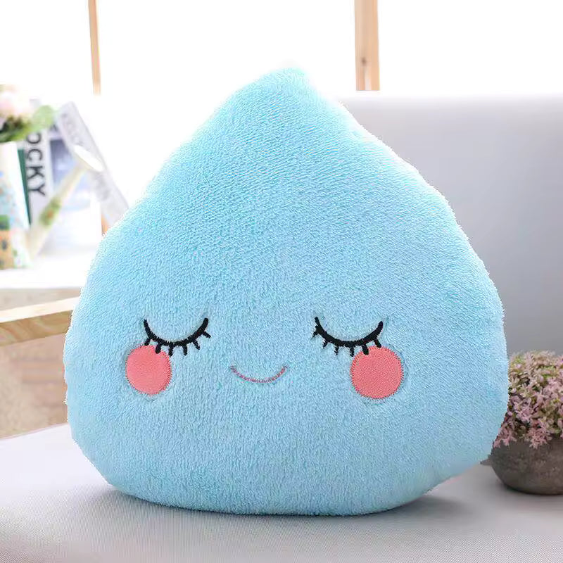 Cute blue kawaii plush pillow with face on a light surface