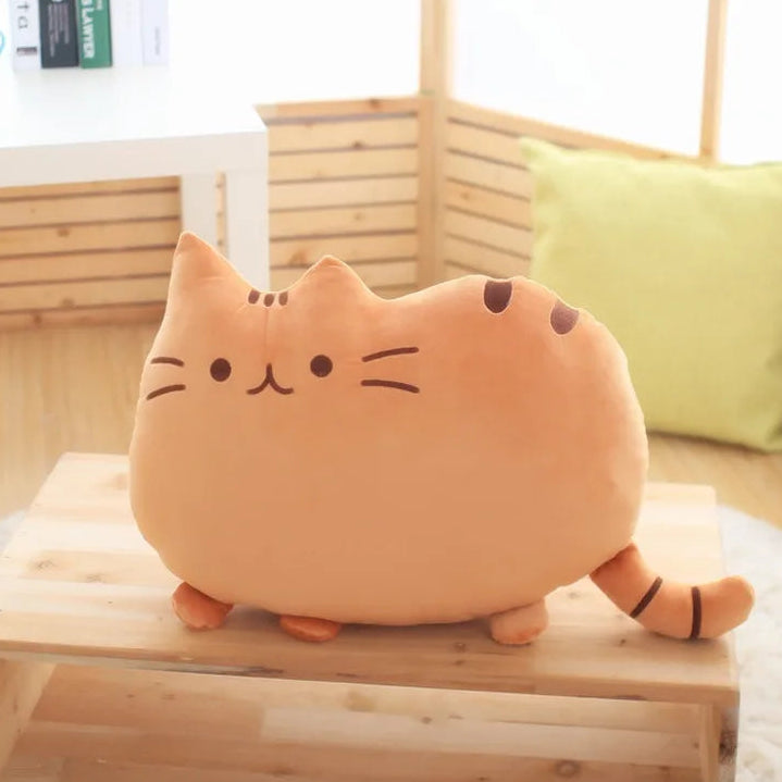 Cat-shaped plush kawaii toy on a wooden surface with a blurred background