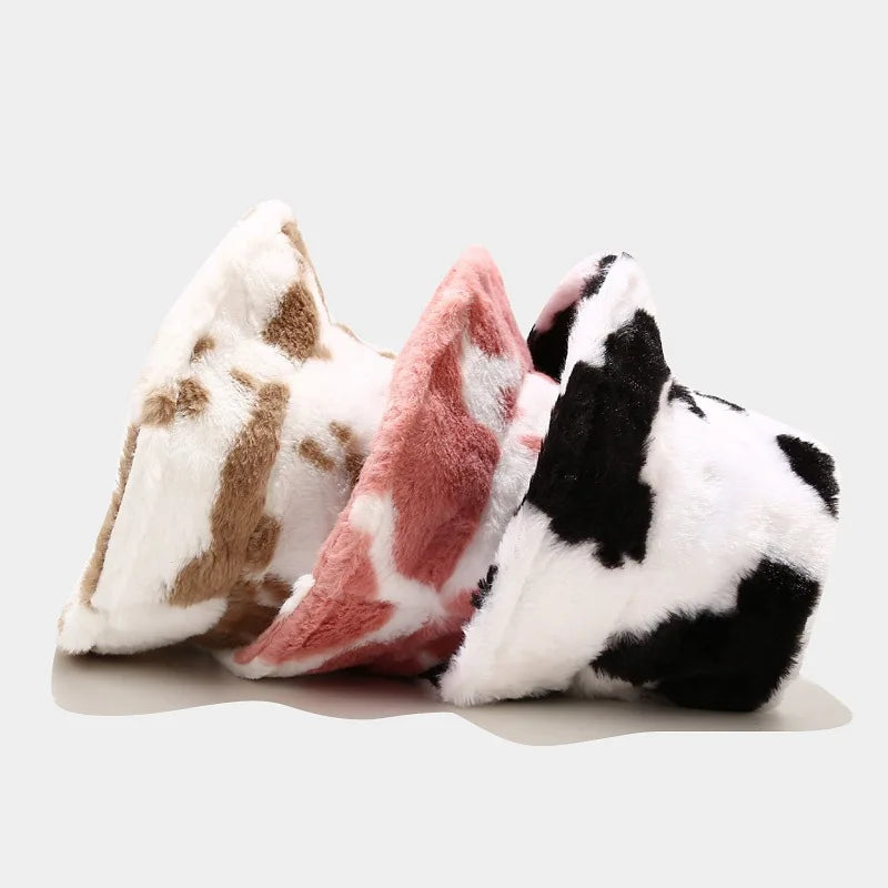 Three plush animal Kawaii hats in different designs on a light gray background