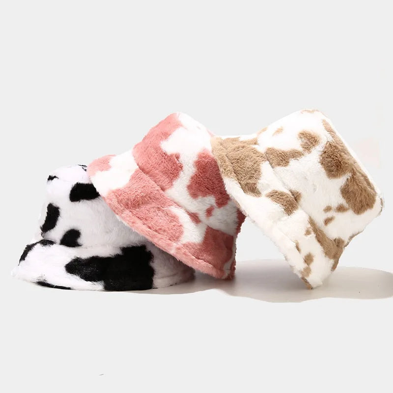 Four fleece Kawaii hats with different patterns on a white background