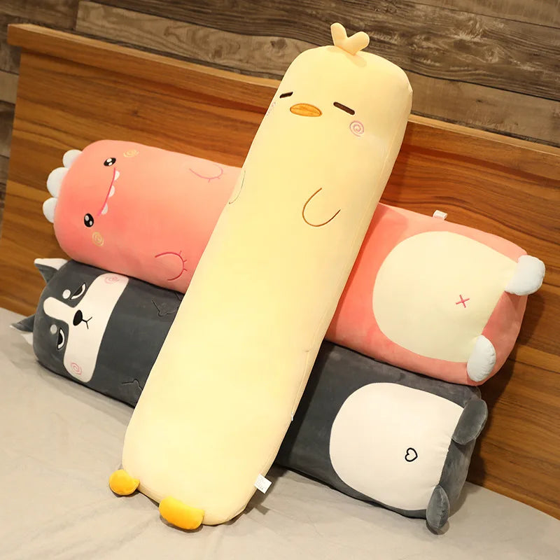 Set of cartoon animal-shaped kawaii cushions on a bed with wooden headboard