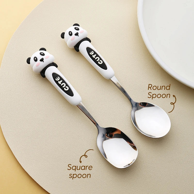 Two panda shaped kawaii spoons on a table