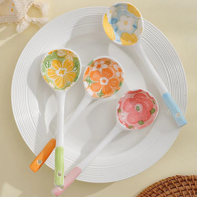 Four flower designed kawaii spoons on a white plate
