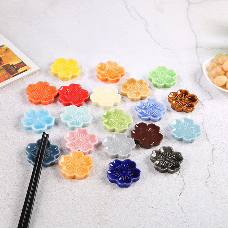 Conch ceramic kawaii chopstick holders in various colors on a light background